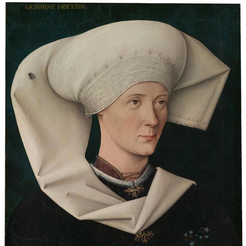 Why does this lady have a fly on her head?